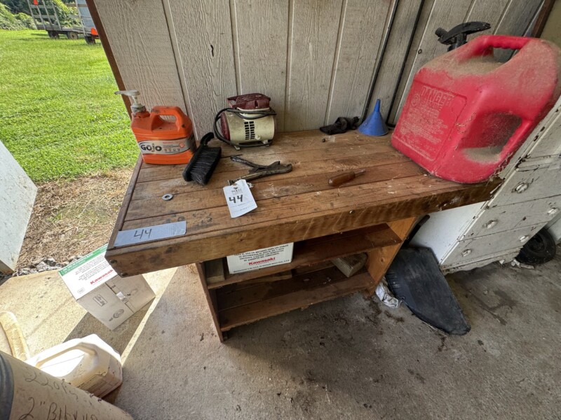 Lot 44: Wood bench and contents.